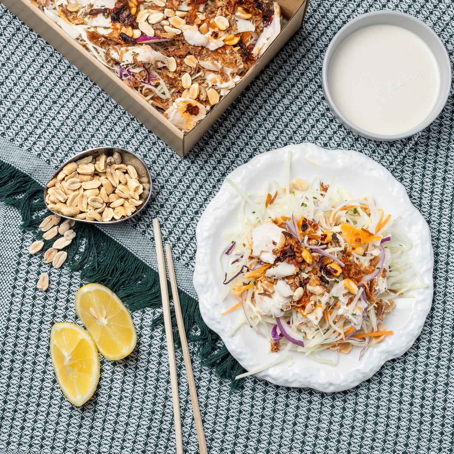 Papaya with shredded chicken, white cabbage, crispy shallots, crispy peanuts, roasted coconut, palm sugar & coconut cream dressing